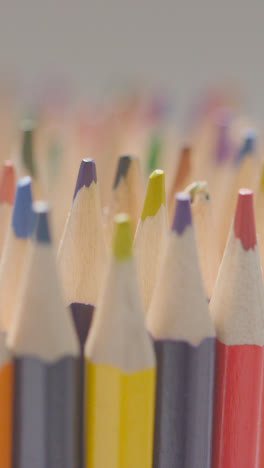 Vertical-Video-Studio-Shot-Of-Multi-Coloured-Pencils-With-Hand-Choosing-Pink-Pencil